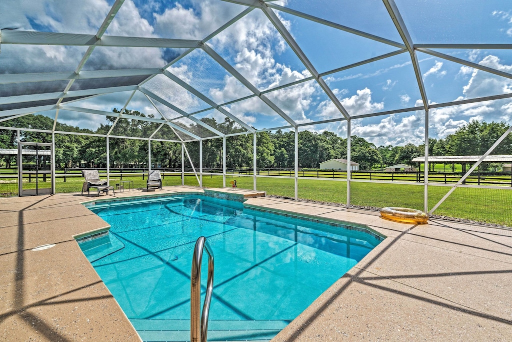 view of the screened in pool of the 6 acre retreat 