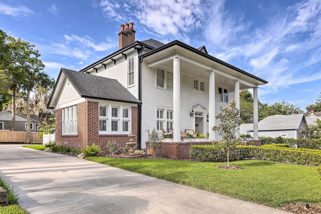 View of the columned front porch of one of the best airbnbs in ocala 