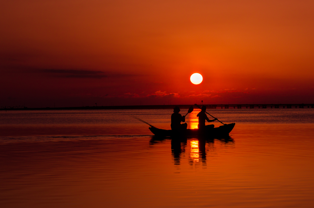 A sunset kayak ride in the ocean