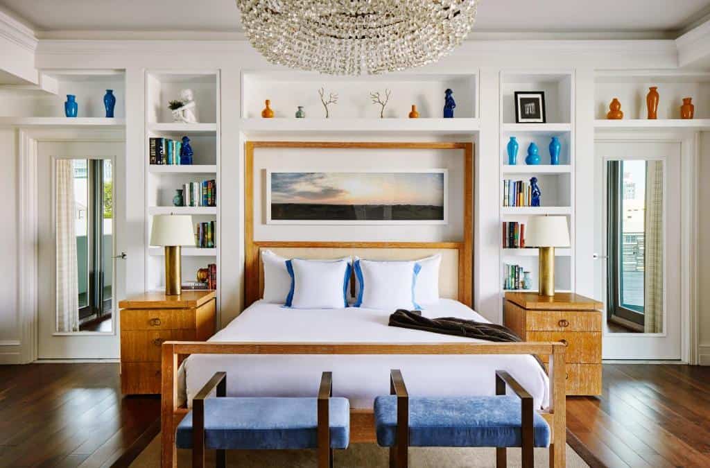 The interior bedroom of the Betsy hotel with hardwood floors and nautical theme 