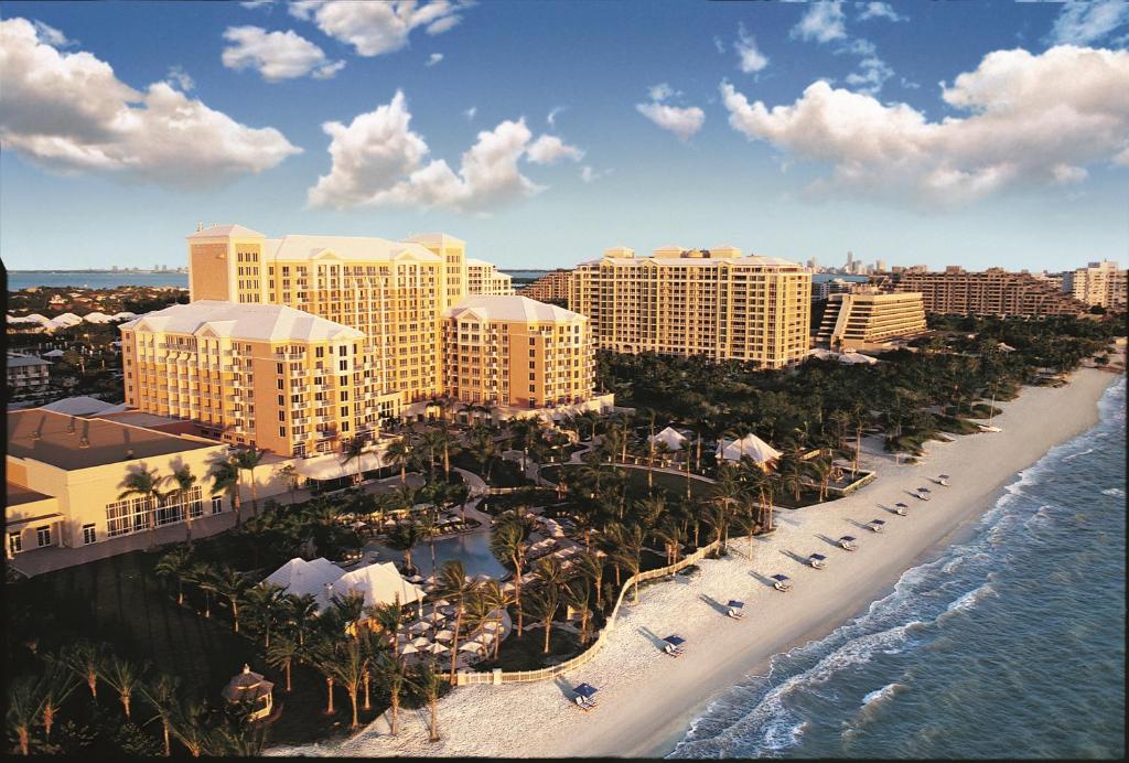 An Ariel view of Key Biscayne with the sandy beach and hotel in the foreground