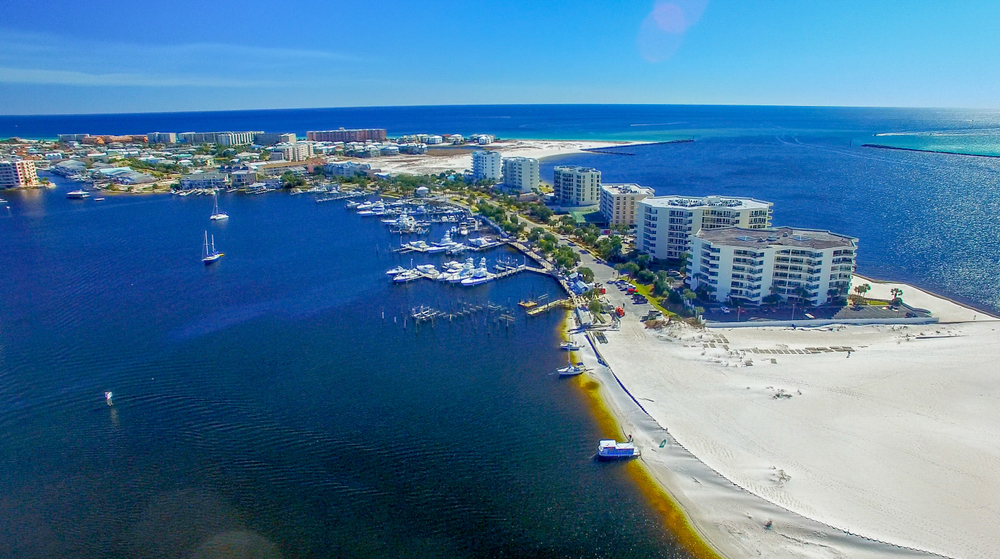 An overview shot of the city of Desitn, Florida shows plenty of options of towering hotels when considering where to stay in Destin. 