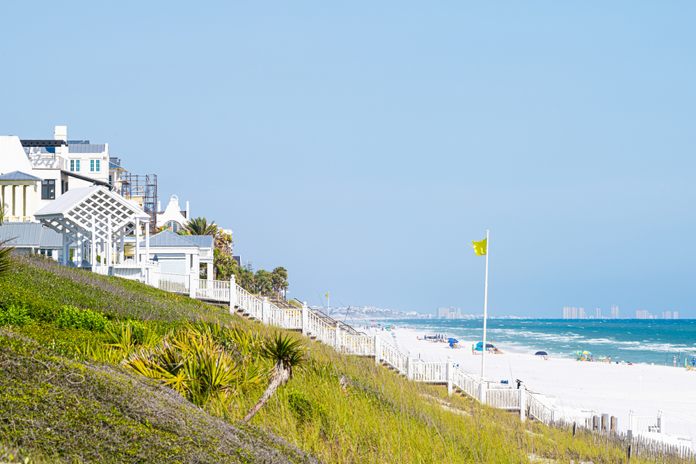 The South Walton area is prefect for considering where to stay in Destin: here, steps and mansions and greenery tower over the sand dunes that lead into the public beach. 