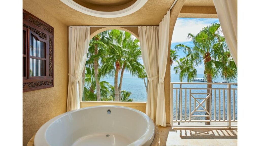beautiful tub in neutral surroundings to highlight the ocean outside!