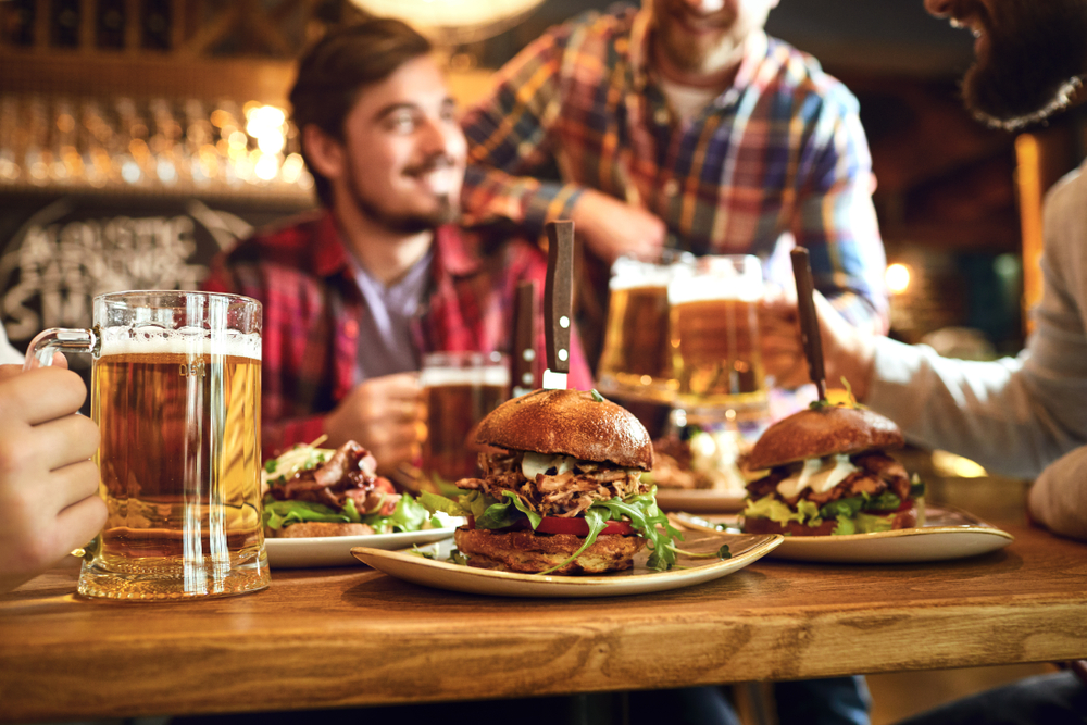 delicious burgers on plates and paired with great draft beers, the perfect combination for every evening outing!