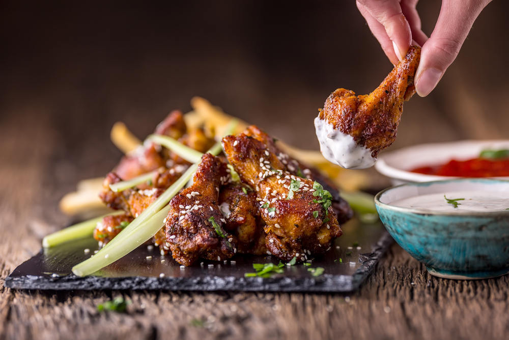 delicious looking wings paired with veggies and a variety on dips!