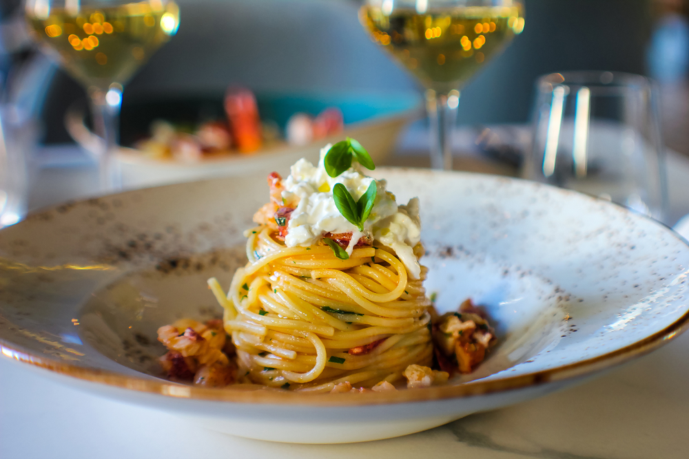 a pasta dish with whipped ricotta and greens