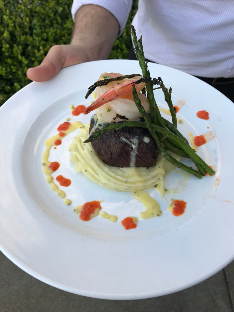 steak topped with shrimp and asparagus 