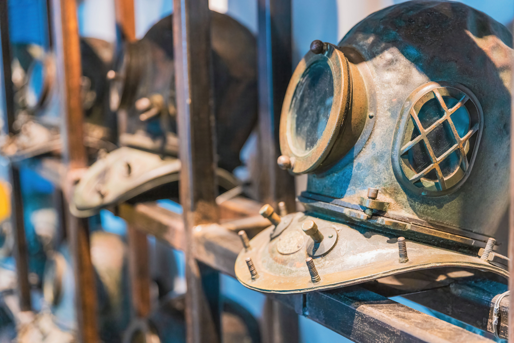 a row of antique diving helmets! Same can be seen at the history of diving museum, one of the best things to do in the Upper Keys