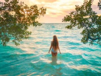 woman standing in the water in key largo one of the upper keys in florida