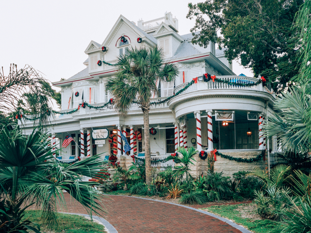 Amsterdams Curry Mansion Inn decoarated for Christmas. Historic bed and breakfast hotel in Old Key West downtown. The artilce is about the best time to visit the Keys.