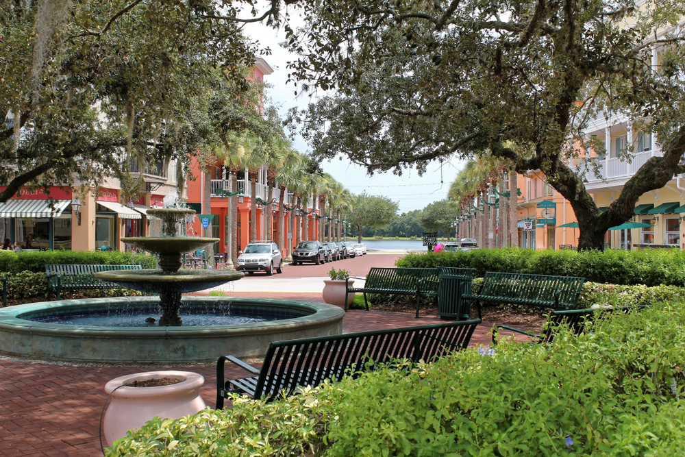 A shot of the downtown area in Celebration florida, there is a lake in the background 