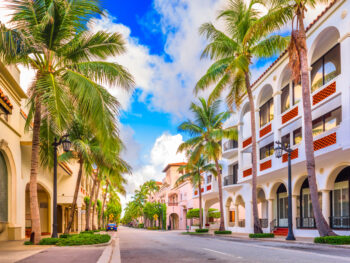 Looking down Worth Avenue on a bright sunny day, one of the best things to do in Palm Beach
