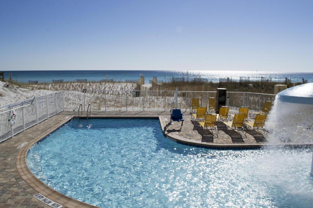 outdoor pool overlooking the sandy beach best beachfront hotels in destin