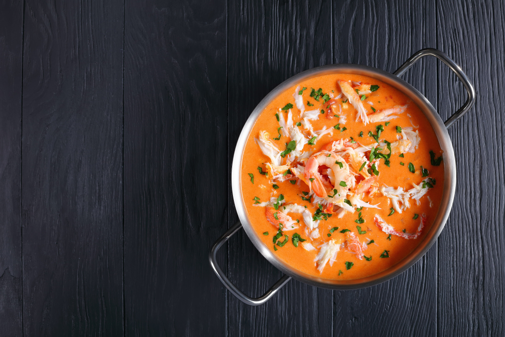 a lobster bisque in a fresh pot, featured at some of the best places to eat in Vero Beach!