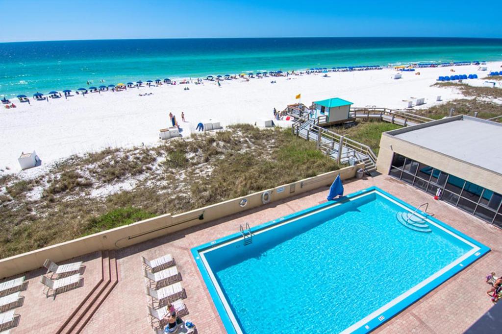 outdoor terrace pool overlooking the beach with blue water best beachfront resorts in destin