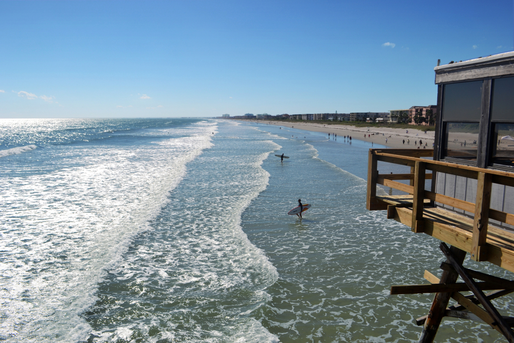 surfing is one of the best things to do in Cocoa beach with shallow water and warm waves