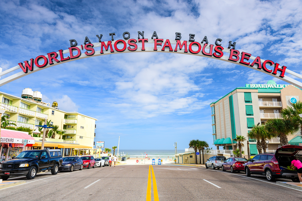 Daytona Beach sign. The popular spring break destination is dubbed "World's Most Famous Beach." The article is about the best time to visit Florida 