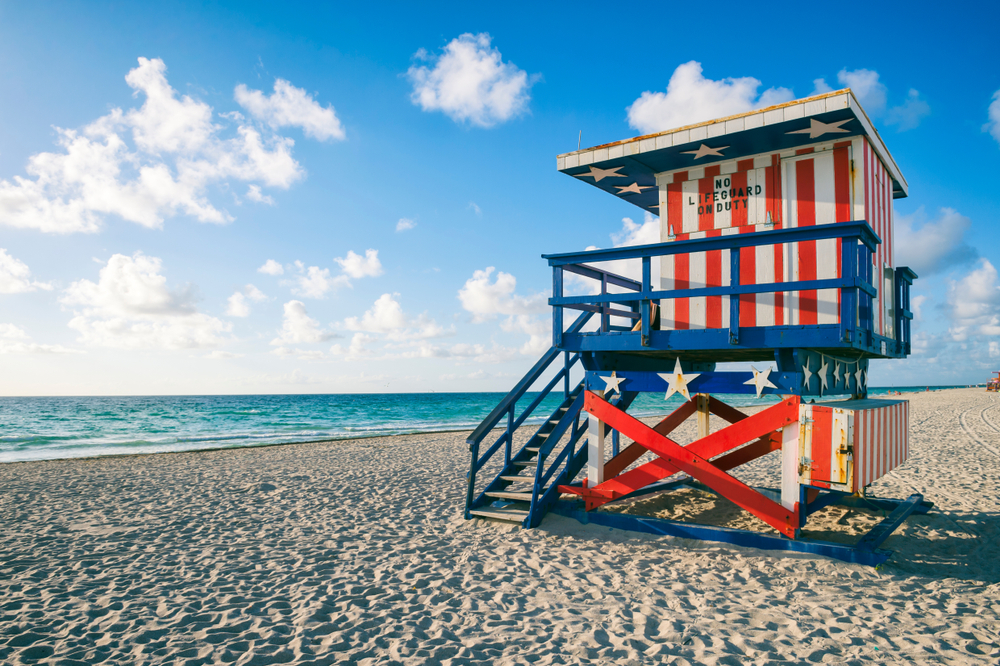 Colorful US Flag stars and stripes lifeguard tower on Miami Beach, Florida in an article about Florida in July 