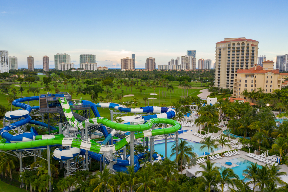An aerial view of the Tidal Cove Waterpark where there are large pools and multicolored water slides