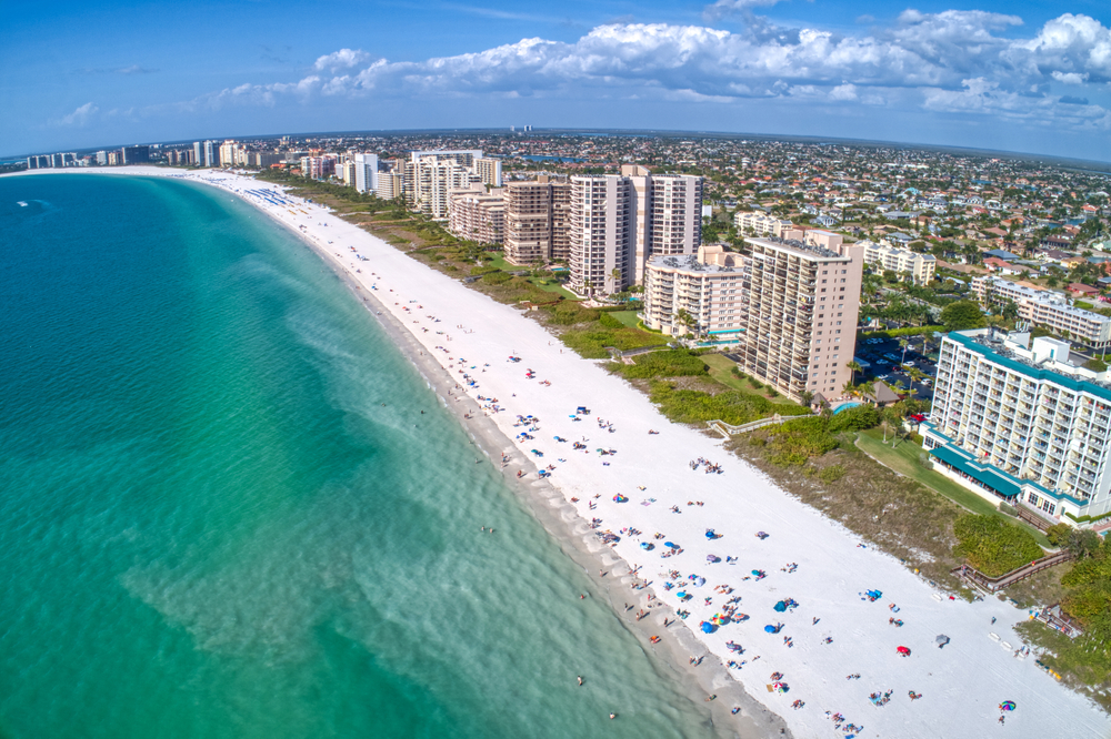 aerial view of seashore with lots of buildings beside itbest beach resorts on marco island