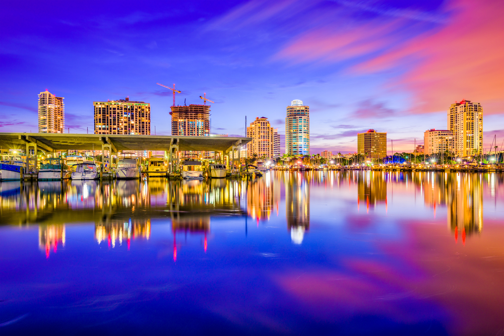 The St. Pete skyline all lit up during twilight