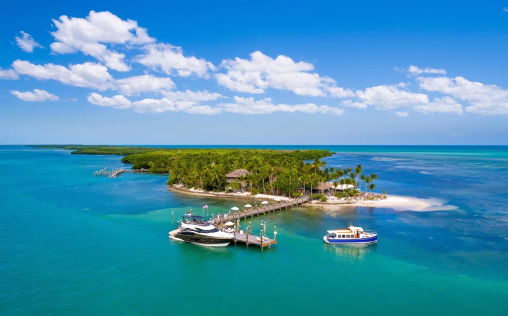 the dock on the private island of little palm island with a private yacth 