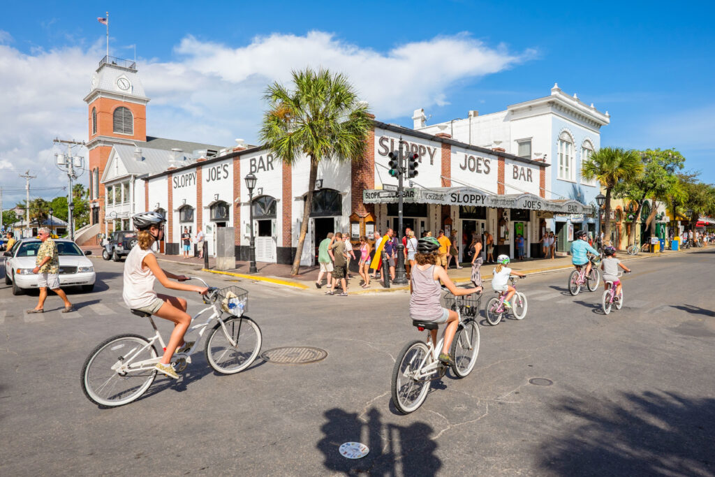 People riding bikes to Key West’s Slopy Joe’s, one of the best places to visit in Flordia in September