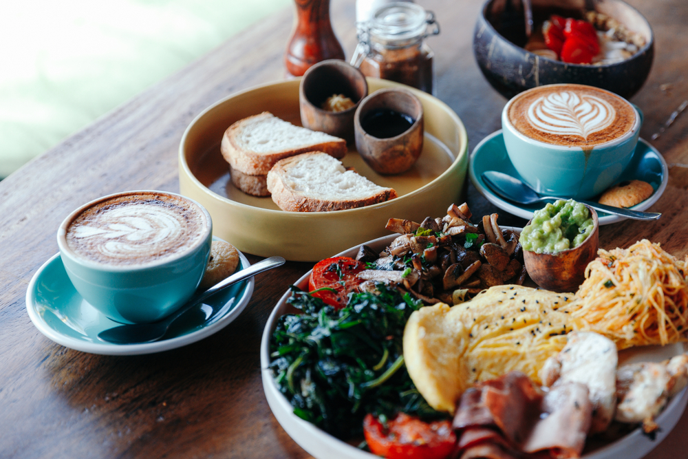 An assortment of brunch dishes with coffee, eggs, toast, pastries, at the best brunch in orlando