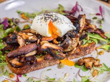 toast with mushrooms and egg on a plate at a brunch restaurant in orlando