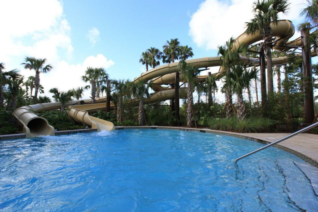 Two long twisty slides lead into a deep pool at the Orlando Center Marriott which is one of the  best waterpark hotels in Orlando.