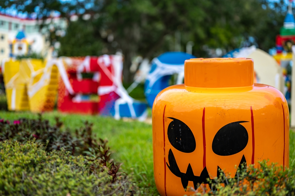 In Florida in October LegoLand and other theme parks put on Halloween events, as shown by the lego head that is decorated like a jack-o-lantern at the front of the park. 