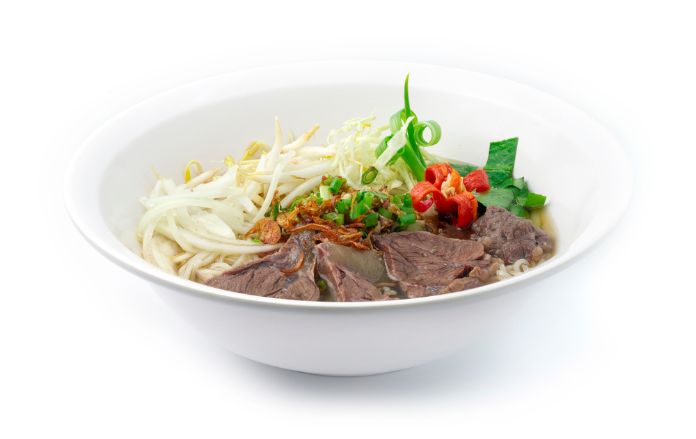 A bowl of Pho, featuring noodles, bean sprouts, and meat in a broth, like the bowls served at Twenty Pho Hours, one of the best late-night restaurants in Orlando.