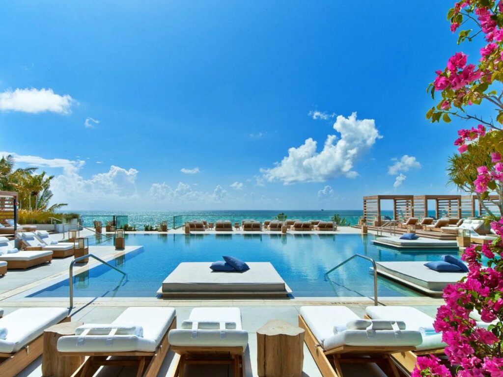 a picture of the open air infinity pool at 1 hotel South Miami beach with the ocean in the background, best beach resorts in Miami