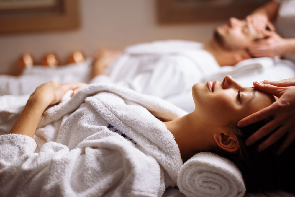 A couple gets a facial massage at a spa in Orlando. 