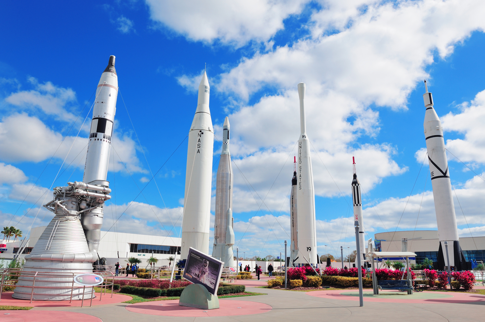  Kennedy Space Center Rocket Garden. The rockets are standing up surrounded by flowers.  