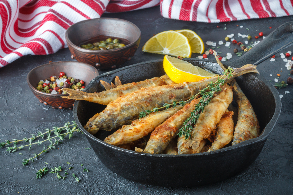 Fried smelt in a frying pan