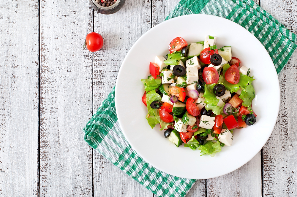 Greek salad on a white plate best restaurants in Tarpon Springs