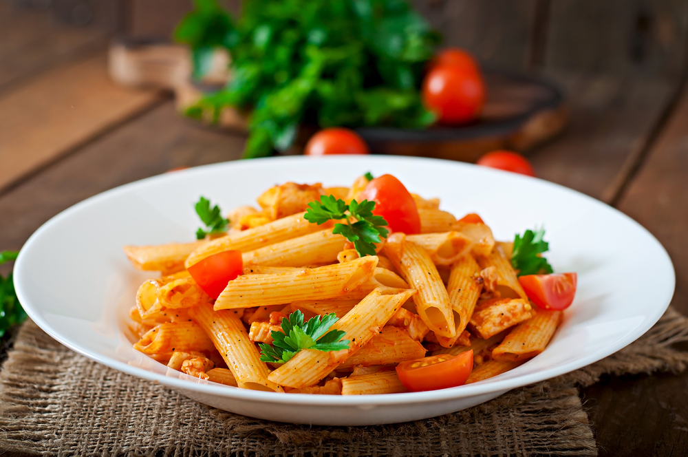 This penne pasta is done in a red sauce with tomatoes and basil at one of the best restaurants in Siesta Key that features Italian food. 