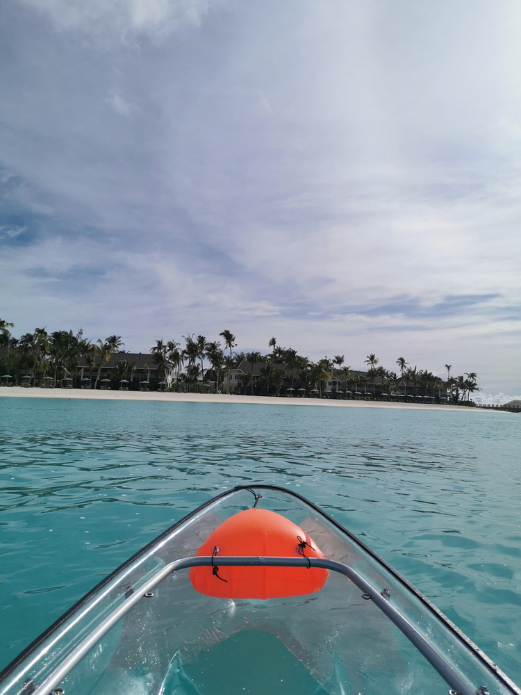 a glass bottom kayak in the crystal clear water