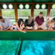 Guests gaze and gather at the underworld of fish and ecosystems on the Silver Springs glass bottom boat tours in Ocala, Florida.