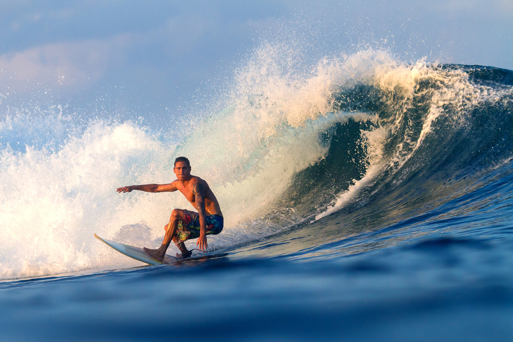 A man surfing in a wave.