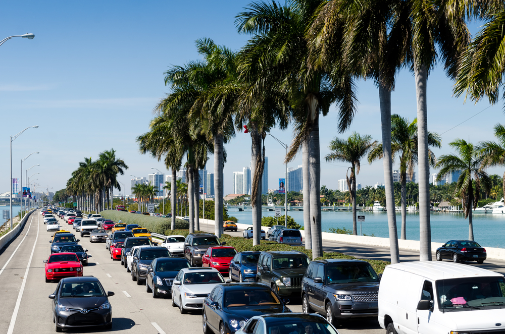 Traffic lies the streets in Miami; cars are bumper to bumper while sitting on the coast's roads. 