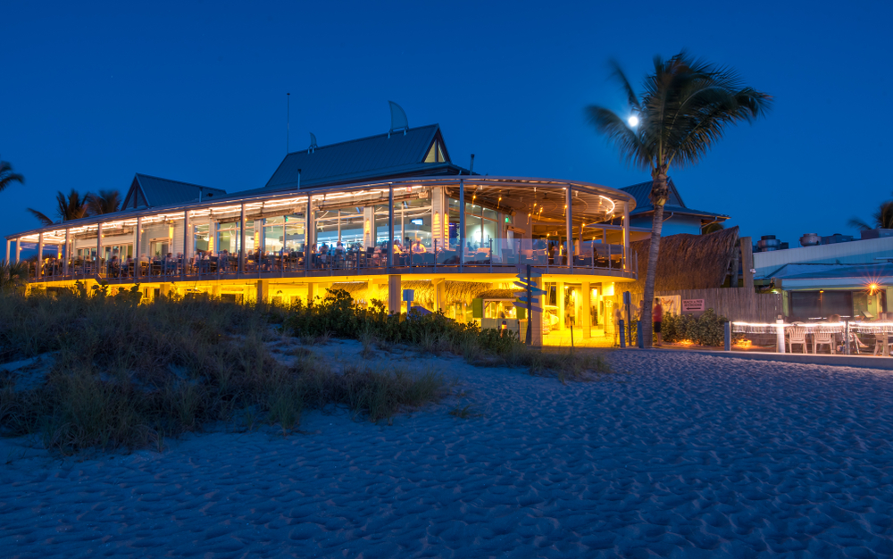 Fisherman pier and Fins restaurant during sunset. The restaurant is glass 
