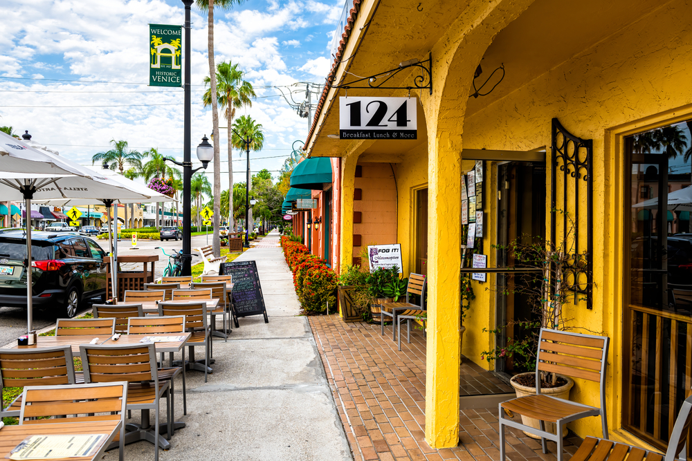 Historic old town of Italian city district in Florida with 124 sidewalk restaurant with outdoor sitting area with empty chairs and tables