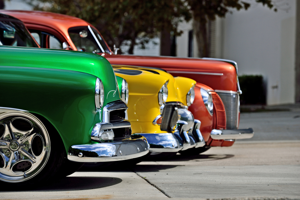 A row of brightly colored classic cars