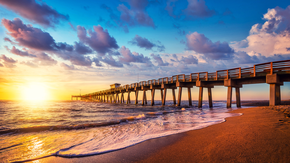 The Venice fishing pier as the sun is setting best things to do in Venice Florida