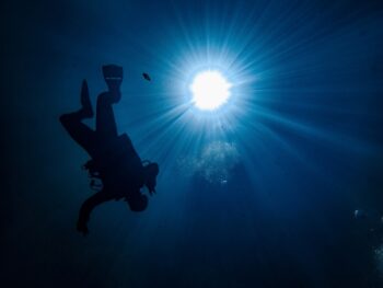 person underwater diving at wakulla springs in florida