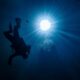 person underwater diving at wakulla springs in florida