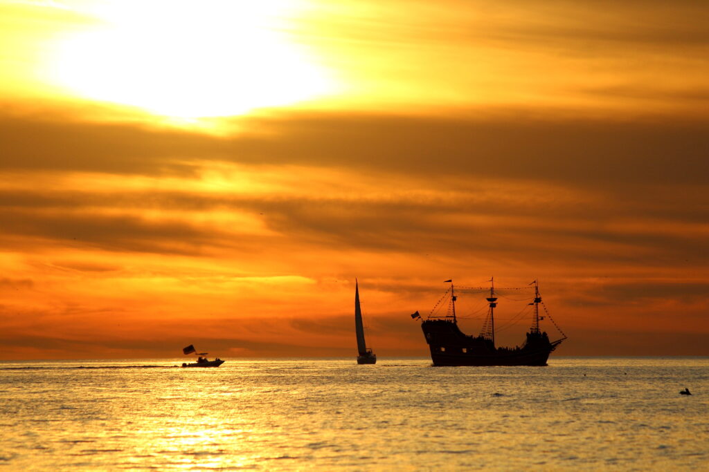 The pirate ship in Clearwater offers up close and personal views of sunsets in Florida: the ship itself is silhouetted in this photo in comparison to the bright sun. 